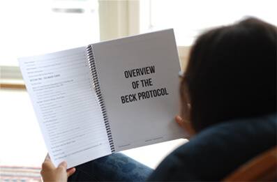 Image Woman Reading Beck Protocol Handbook